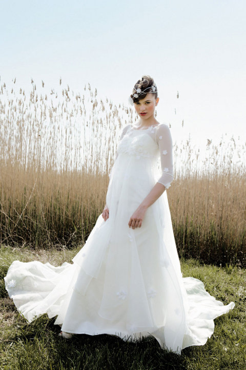 Blanche de Boh me is a crossovereffect bustier wedding dress in lace tulle 